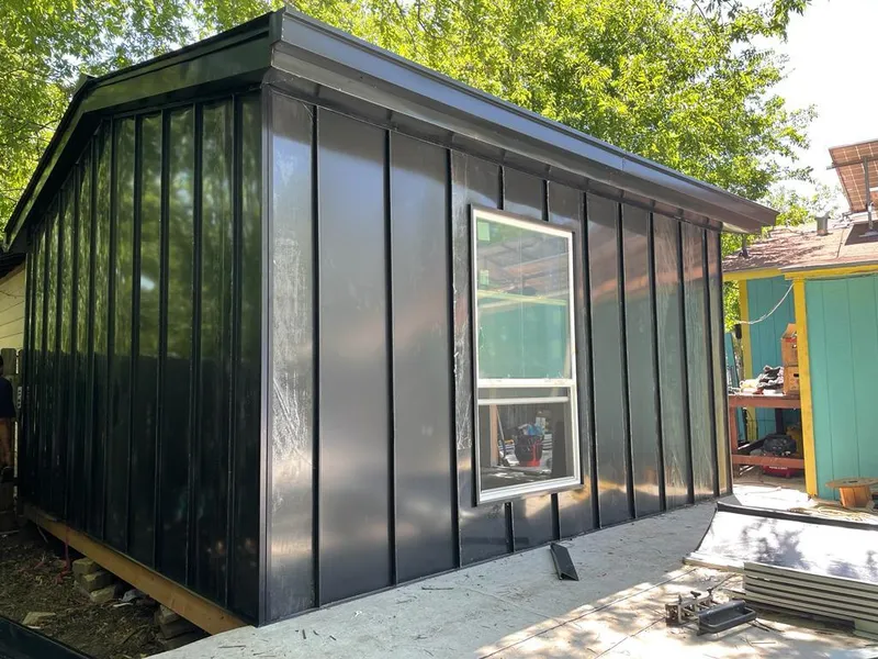 Black standing seam metal wall panels for Roof Inspection in Bryan