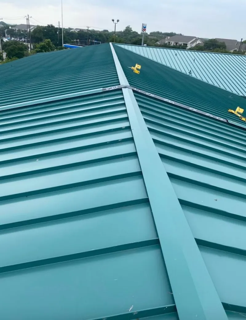 Green commercial metal roof ridge and valley for Metal Roof Repair in Bryan