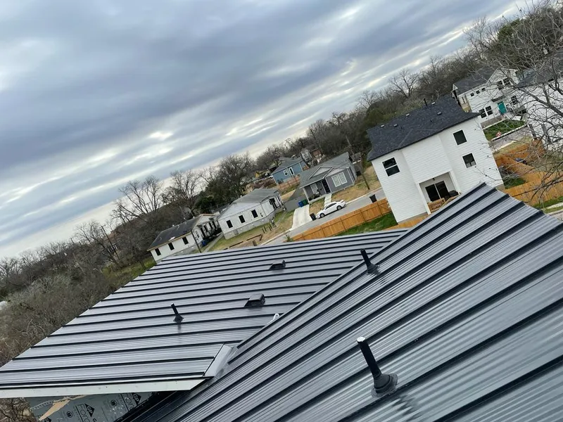Standing seam metal roof panels with vents for Skylight Repair in Bryan